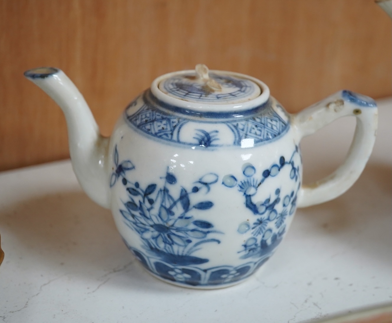 A Worcester teapot, c.1770, an 18th century Chinese famille rose and a blue and white dish, a small blue and white dish, a cup and saucer and teapot, largest dish 39cm (7). Condition - most damaged, cracked or chipped